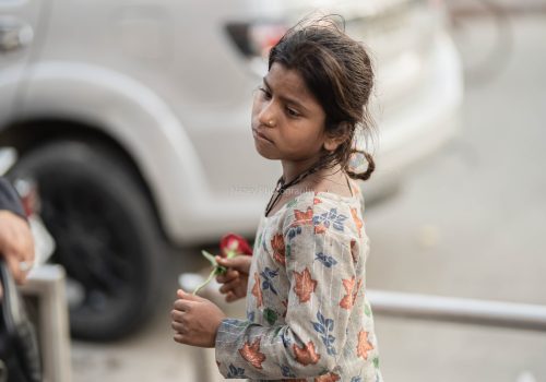 A poignant moment captured by Nazeem: A little girl in Sector 18 market, Noida, holding a red rose with a face full of untold stories and silent dreams. Her eyes speak volumes, reflecting both innocence and the harsh realities of life.