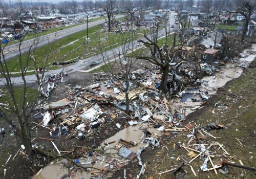 Debris scatters the ground near damaged homes following a severe storm Friday, March 15, 2024, in Lakeview, Ohio. (AP Photo/Joshua A. Bickel)