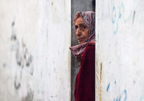 A Palestinian woman stands at al-Najar hospital in Rafah in the southern Gaza Strip on February 16, 2024, amid ongoing battles between Israel and the Palestinian militant roup Hamas. (Photo by MOHAMMED ABED / AFP)